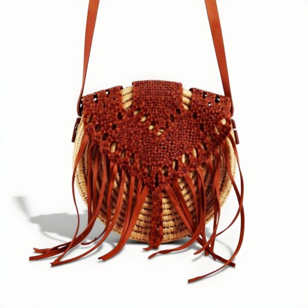 Handmade circle straw bag with rust macramé overlay and leather fringe - boho crossbody purse with adjustable strap