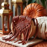 Round boho straw bag with rust macramé leather overlay and long fringe in interior setting