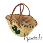 Interior view of handwoven straw beach bag showing fabric lining and spacious design