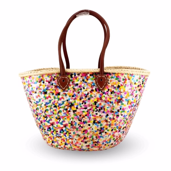 Handmade Moroccan straw bag with rainbow sequin pattern on white background