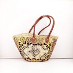 Embroidered straw tote bag with yellow and black daisy pattern, handwoven basket with leather straps