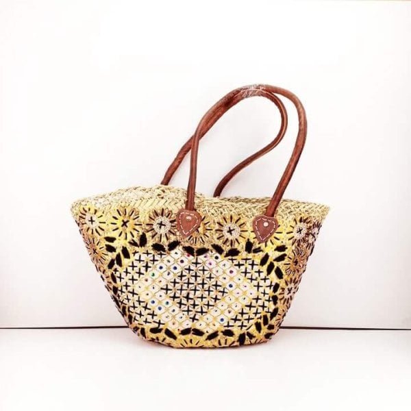 Embroidered straw tote bag with yellow and black daisy pattern, handwoven basket with leather straps
