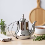 Polished stainless steel teapot in modern kitchen setting