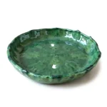 Handcrafted green Tamegroute ceramic plate with irregular scalloped rim and authentic mottled glaze pattern, 20cm diameter