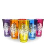 Six jewel-toned hamsa hand tea glasses in silver metal filigree holders on white background