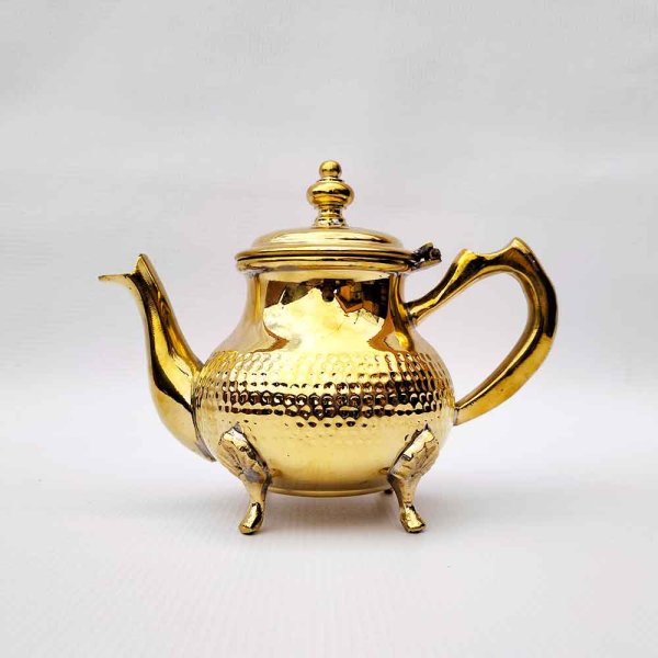 Gold hammered silver teapot with lid open, showing interior and decorative textured band detail