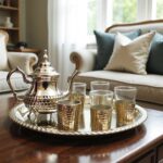 Top-down view of silver plated tea set on scalloped tray showing hand-hammered dimple texture and six holders