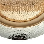 Hand hammered brass tea tray close-up showing silver-plated surface with traditional dimpled metalwork texture and craftsmanship