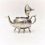 Side view of silver-plated large teapot