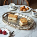 Side view of silver-plated brass geometric serving tray with pierced moucharabieh gallery rim and cutout handles