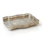 Hand-engraved rectangular Moroccan silver tray with decorative feet, handcrafted from silver-plated brass by artisans in Marrakech.