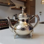 Traditional silver teapot in bright setting