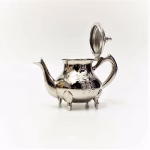 Hamsa engraved teapot with decorative feet