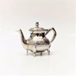 Traditional Moroccan teapot on white background