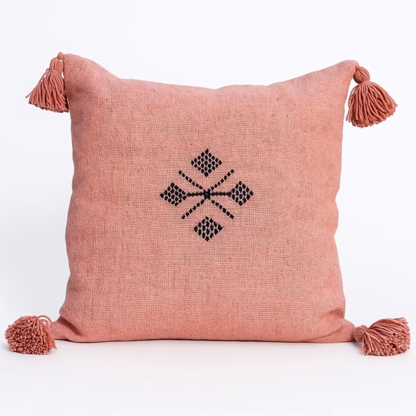Coral Moroccan boho cushion with playful corner tassels