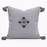 Light gray Moroccan cushion with traditional embroidered pattern