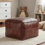Dark brown square leather ottoman pouf in children's room with natural lighting and soft textures