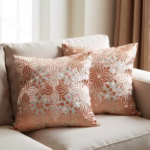 Orange decorative pillow covers in sunlit living room
