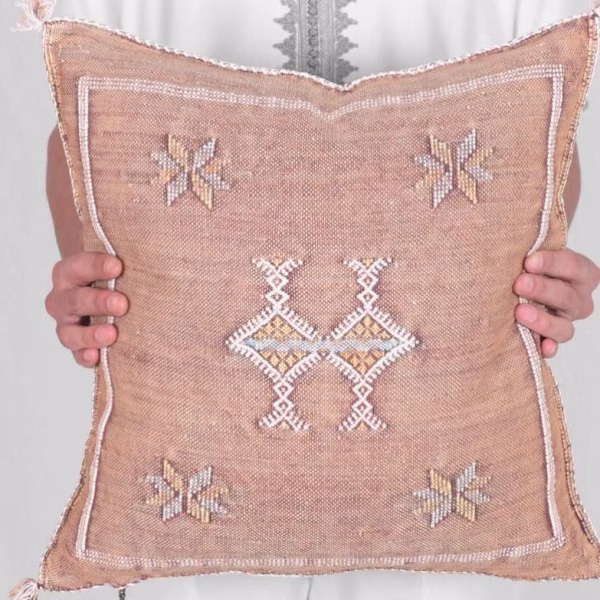 Light orange cactus pillow cover with traditional motifs
