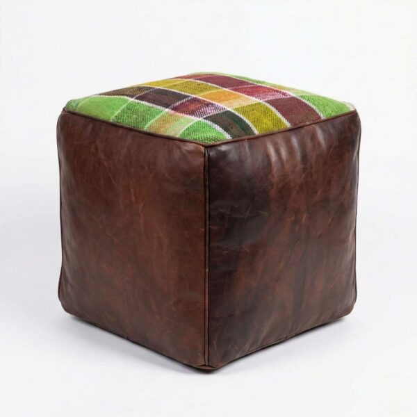 Dark brown leather cube ottoman with colorful kilim patchwork top featuring green, burgundy, and yellow geometric squares
