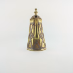 Side profile of Moroccan old copper teapot displaying curved handle, decorative spout, and traditional Islamic artwork