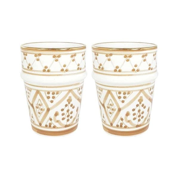 Navy blue ceramic cups with gold band showcasing geometric patterns in traditional handmade style