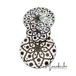 Hand-painted ceramic plates artisan dinnerware with black Moroccan-style patterns arranged vertically