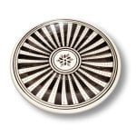 Black and white hand-painted ceramic plate with bold radiating stripes and floral center medallion design