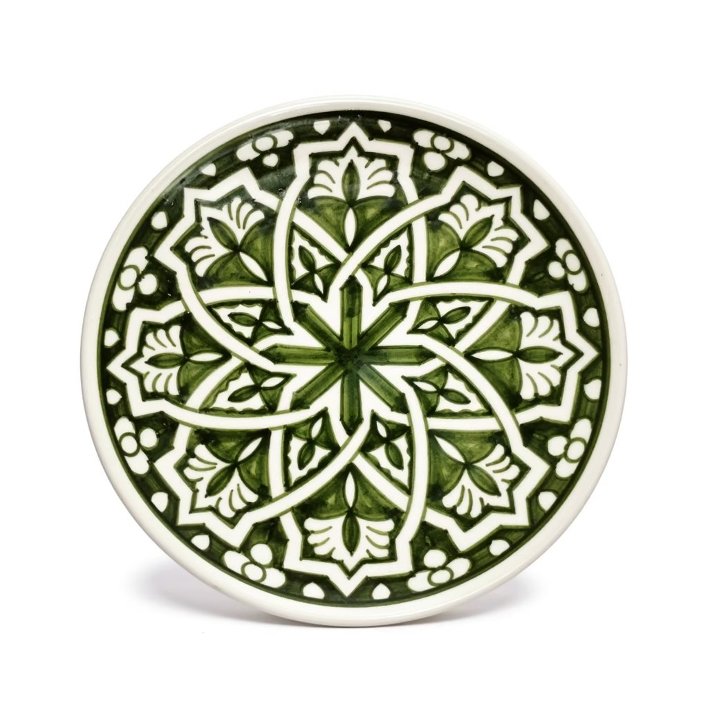 Close-up of green pottery serving dishes showing intricate hand-drawn patterns Hand-drawn geometric ceramic serving dish 25cm with forest green star mandala pattern and cream border detail