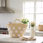 White star straw tote handbag in bright kitchen setting