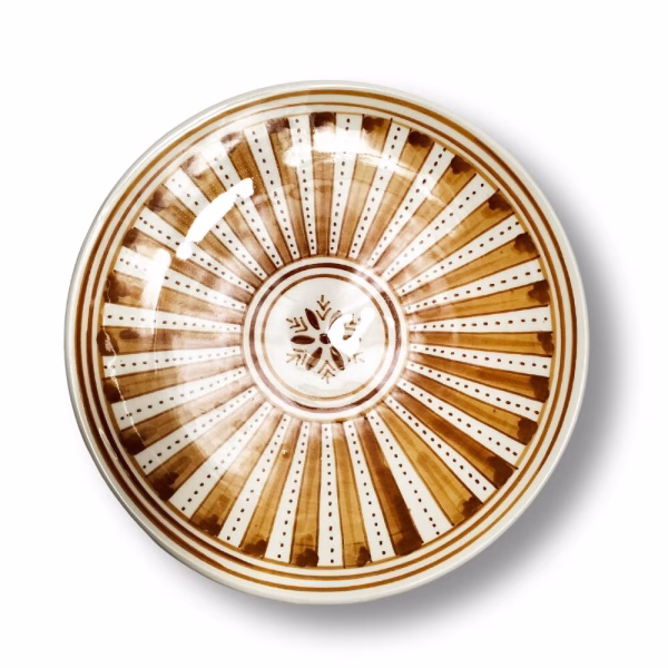Orange ceramic plate painting viewed from above showing central star motif