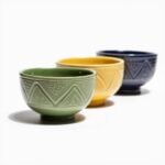 Hand-engraved geometric ceramic bowl set in green, yellow, and navy with chevron patterns