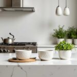 White geometric ceramic bowls with zigzag patterns displayed on modern kitchen counter