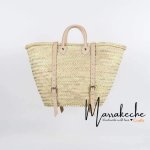 Convertible straw backpack with natural leather straps and buckles, handwoven herringbone basket design