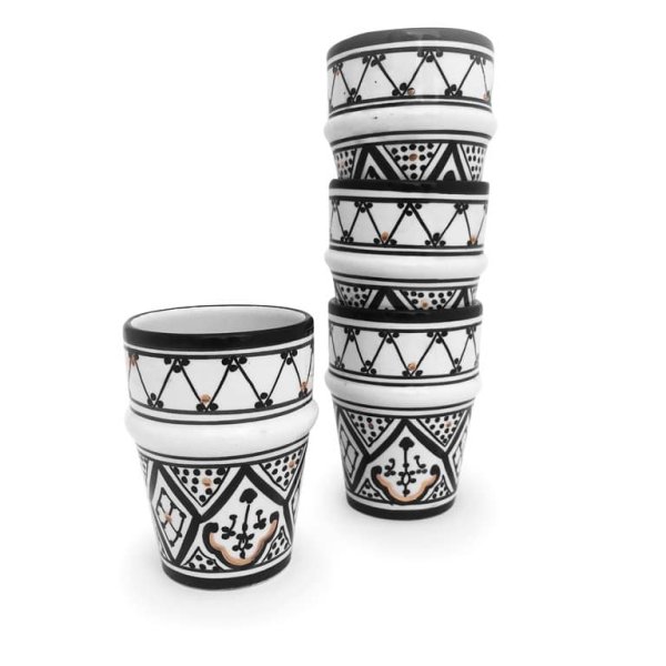 Two black and white striped ceramic cups with gold trim, bold handmade pottery design