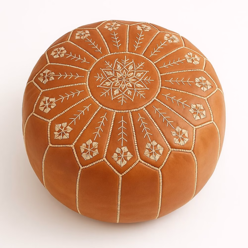 Detailed view of embroidered Moroccan leather pouf pattern