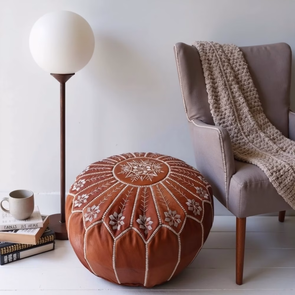 Handcrafted leather ottoman pouf with floor lamp