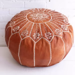 Close-up of handmade leather ottoman pouf embroidery work