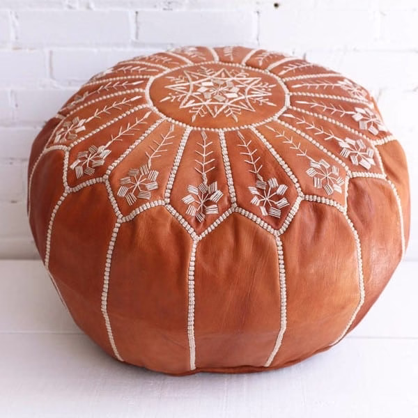 Close-up of handmade leather ottoman pouf embroidery work