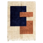 Artisanal Handmade Moroccan Boho Rug with Contemporary Color Block Design Bring artistic expression and warmth to your living space with our exquisite boho rug that perfectly balances traditional Moroccan craftsmanship with contemporary design sensibilities. This statement piece features a bold geometric composition of navy blue and warm terracotta blocks against a natural cream background, creating a sophisticated focal point that transforms any room while providing exceptional comfort underfoot. CRAFTSMANSHIP & DESIGN Each boho rug in our collection represents the extraordinary skill of master artisans from Morocco's celebrated rug-making regions. The process begins with premium locally-sourced wool that is hand-processed using time-honored methods before being meticulously hand-knotted into these distinctive pieces. What makes this boho rug truly special is its contemporary interpretation of traditional Moroccan design language. The bold color blocks draw inspiration from mid-century modern art while maintaining the authentic handcrafted character that defines genuine Moroccan textiles. The harmonious interplay between deep navy blue, warm terracotta, and natural cream creates a sophisticated palette that complements both contemporary and eclectic interiors. Unlike mass-produced alternatives, each rug bears subtle variations that reflect its handcrafted nature. These unique characteristics are hallmarks of authentic artisanal work, making each piece a one-of-a-kind treasure with its own personality and story. The thick, plush pile provides luxurious softness that invites barefoot comfort while ensuring exceptional durability. FEATURES Premium 100% natural wool construction Bold contemporary color block design in navy blue and terracotta Multiple size options: Small: 1.5 x 2 meters (4'11" x 6'7") Medium: 2 x 3 meters (6'7" x 9'10") Large: 3 x 4 meters (9'10" x 13'1") Thick, plush pile for luxurious comfort underfoot Secure hand-knotted construction ensuring impressive durability Natural fringe detailing along edges Made-to-order with 4-week production time Entirely handcrafted by skilled artisans in Morocco Each piece is unique due to the handmade process PERFECT FOR Our modern boho rug collection is ideal for: Contemporary interiors seeking an artisanal statement piece Bohemian-inspired spaces celebrating handcrafted elements Mid-century modern rooms needing warmth and texture Scandinavian-Moroccan fusion designs that prize clean lines and warm accents Art-focused spaces where the rug complements a curated gallery wall Neutral interior palettes seeking strategic color introduction Minimalist spaces in need of textural warmth and visual interest Open floor plans requiring thoughtful zone definition CARE INSTRUCTIONS To preserve the beauty and integrity of your wool boho rug: Vacuum regularly using a low-suction setting without beater bar Rotate periodically to ensure even wear Blot spills immediately with a clean, absorbent cloth Professional cleaning recommended for deep cleaning Avoid direct sunlight to prevent color fading For storage, roll the rug (never fold) with the pile facing inward Use a quality rug pad underneath to prevent slipping and extend lifespan Our commitment to traditional weaving methods embraces sustainable practices in handmade crafts, honoring both environmental responsibility and cultural heritage preservation. WHOLESALE OPPORTUNITIES Interior designers, hospitality professionals, and retailers can explore our wholesale program for competitive pricing on bulk orders. We offer customization options including bespoke dimensions, color variations, and pattern modifications to meet specific project requirements. Our dedicated team works closely with design professionals to ensure perfect execution of your vision. For more authentic floor covering options, browse our complete Moroccan rugs collection. Each boho rug in our collection represents the perfect marriage of traditional craftsmanship and contemporary design sensibility. Artisanal Moroccan boho rug with contemporary color block pattern and natural wool fringe