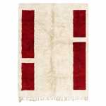 Artisanal Moroccan rug with red geometric pattern on cream wool background