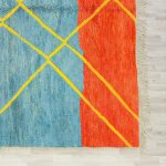 Corner detail showing handmade fringe and color blocking on multicolor Moroccan wool rug