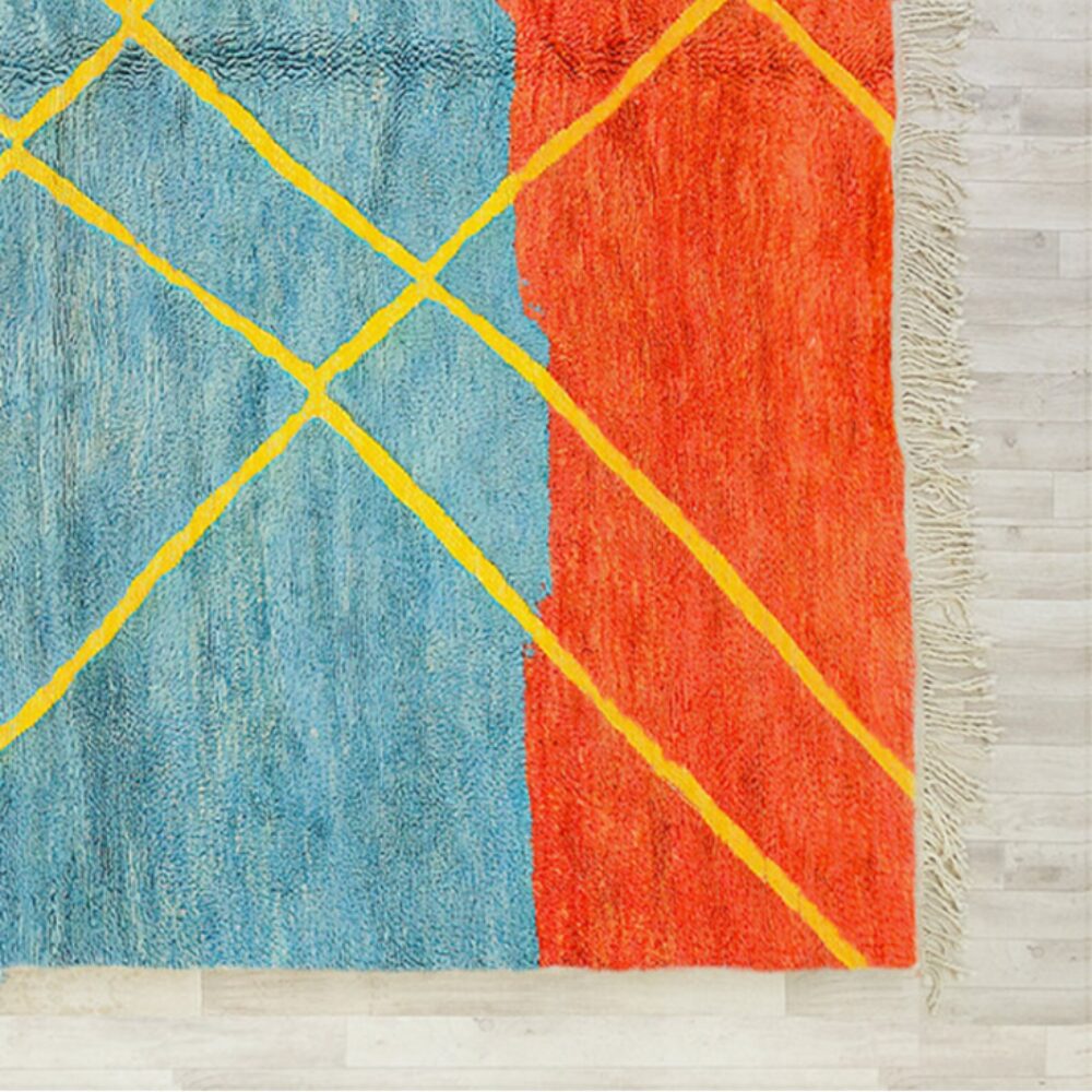 Corner detail showing handmade fringe and color blocking on multicolor Moroccan wool rug