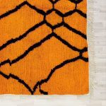 Edge detail showing fringe and weaving technique of handcrafted Moroccan wool rug