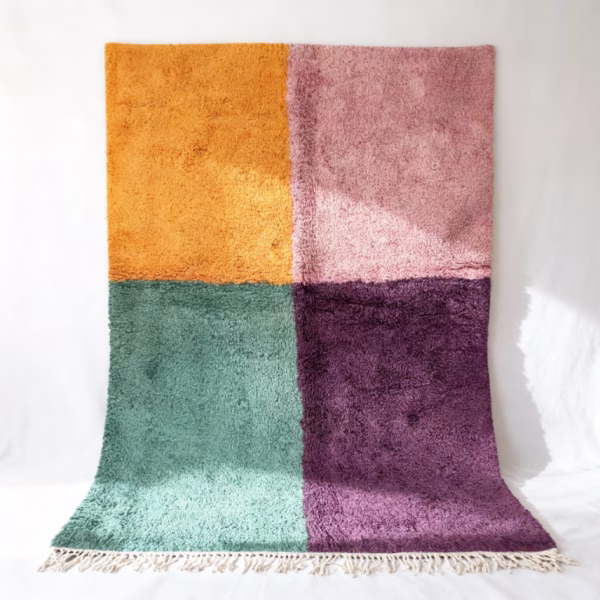 Handcrafted colorful Moroccan rug with four-quadrant color block design in purple, green, pink, and yellow