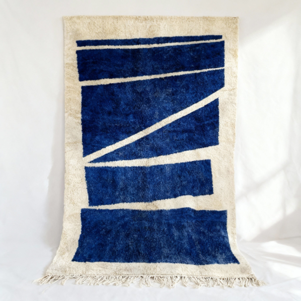 Handmade Moroccan Beni rug featuring contemporary geometric design in deep navy blue and cream