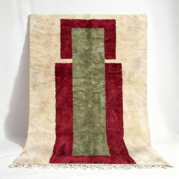 Handmade Moroccan rug featuring burgundy frame with sage green center on cream background