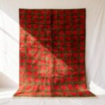 Red and brown handmade Moroccan trellis rug with classic checkerboard design