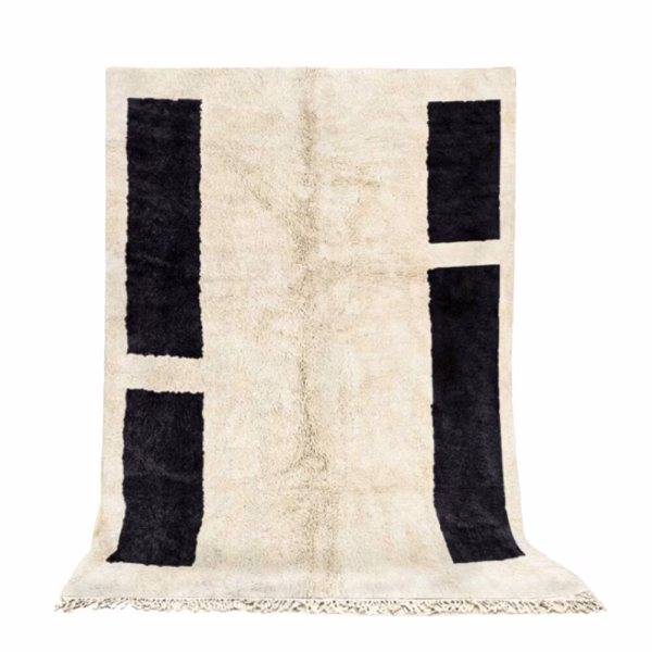 Handmade Moroccan wool rug with vertical black rectangles on cream background