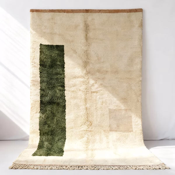 Handmade boheme rug with cream background and green accents, full view
